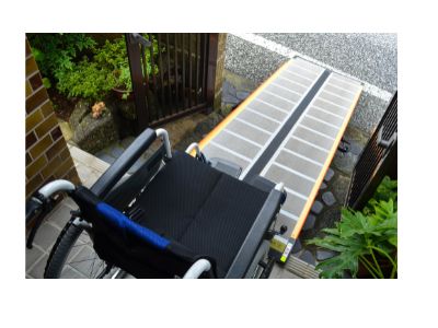Photo of a wheelchair & wheelchair ramp at a residential house